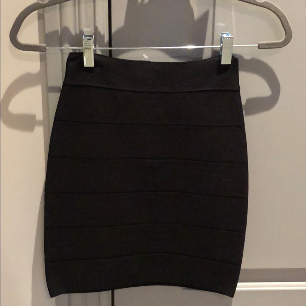 Black Bebe miniskirt with gold 1/4 zip in back